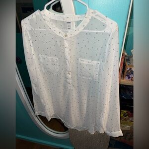 A white sheer blouse with silver stars